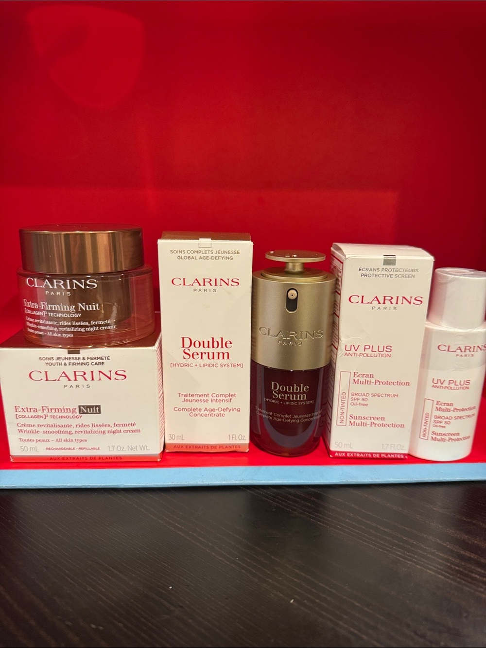 Clarins Skincare Set with Red and Gold Accents